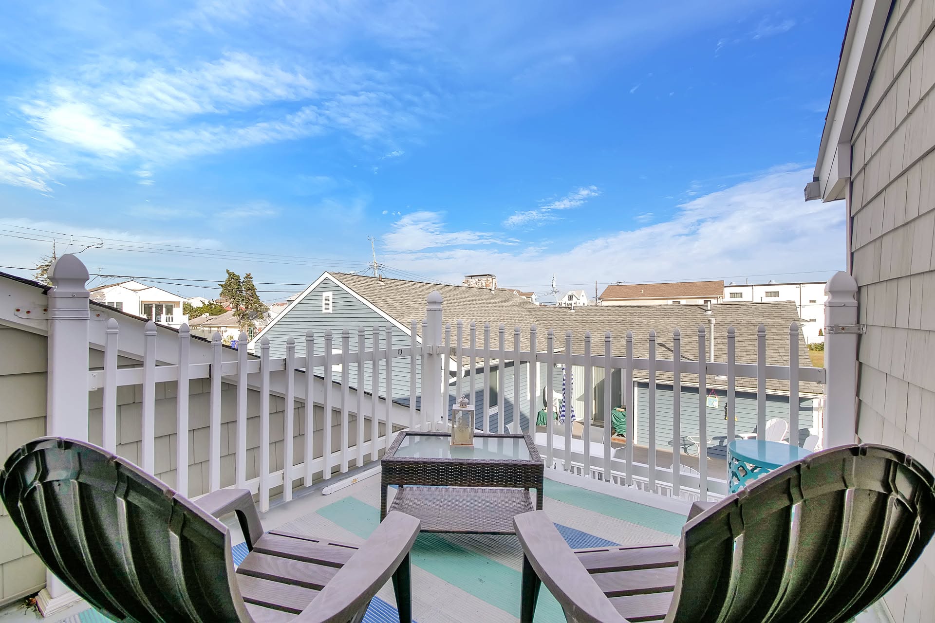 Rooftop deck with adirondack chairs